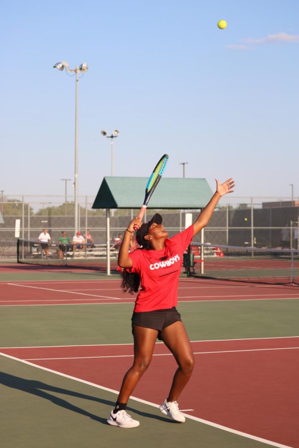 Coppell junior Saryu Thallapareddy serves in her singles practice against Prosper at the Coppell Tennis Center on Friday. Coppell defeated Prosper, 15-4.