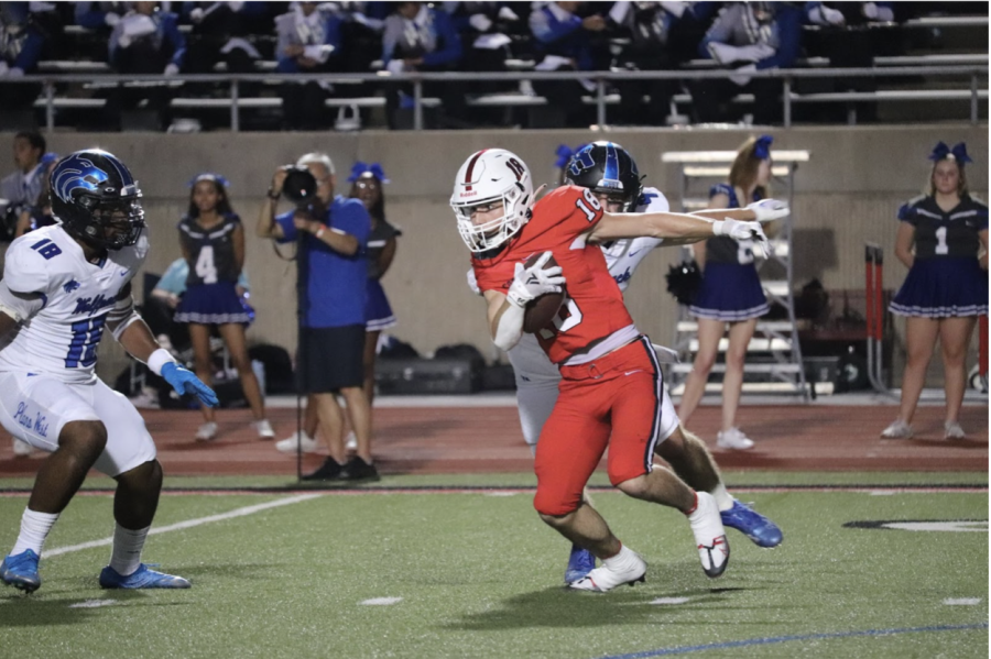 Coppell senior wide receiver Zack Darkoch rushes against Plano West on Buddy Echols Field on Friday. Coppell defeated Plano West, 46-35, during its District 6-6A opener.
