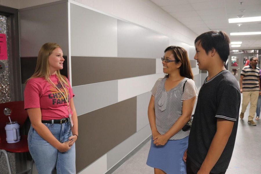 CHS9 Honors Biology teacher Hilary Schieffer speaks with freshman John Lau and parent Daffodil Chan during Tuesday evening’s open house. CHS9 hosted an open house for teachers to interact with students’ families.