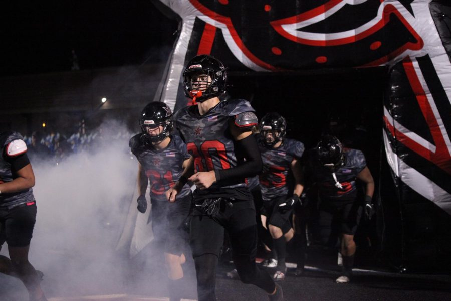 Coppell Cowboys run onto the field after halftime against Hebron at Buddy Echols Field on Oct. 21. Coppell faces the Plano Wildcats tonight at Home.