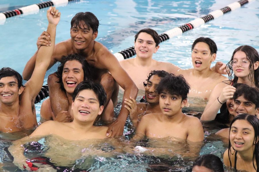 Coppell swimming team members take a group picture at the Coppell Family YMCA on Oct 14. The annual Vaquero Battle featured cannonball, bellyflop and relay intersquad competitions along with other activities to garner student participation.