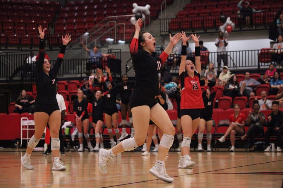Coppell senior outside hitter Skye Lamendola, setter Taylor Young, and defensive specialist Sabina Frosk celebrate a point against Flower Mound Marcus on Tuesday at CHS Arena. Coppell won against Marcus, 25-15, 23-25, 25-17, 25-19.