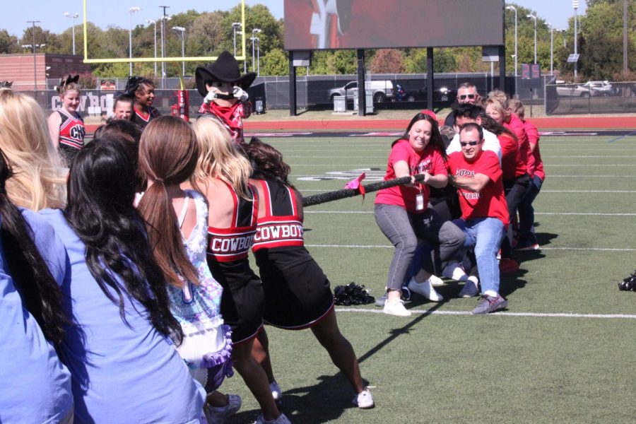 Coppell High School seniors played tug-of-war against CHS teachers after winning a match against CHS juniors at Buddy Echols Field on Friday. Coppell held a pep rally for students to raise school spirit for the volleyball and football games.