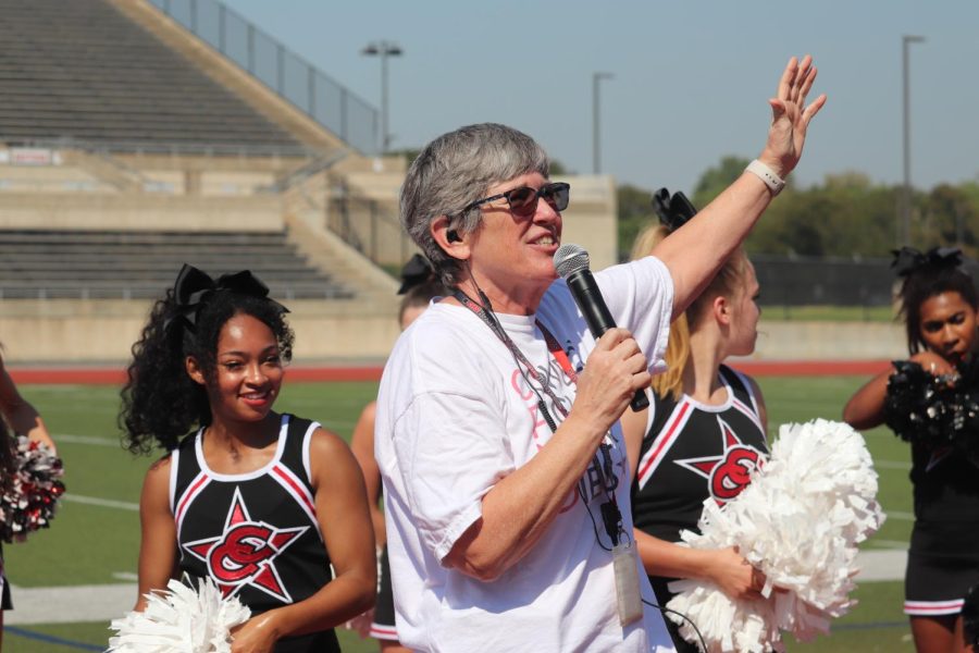 Coppell High School Principal Laura Springer addresses CHS students at Buddy Echols Field on Sept. 23.  Coppell High School held its annual Homecoming pep rally to celebrate various school groups and promote school spirit prior to the game against Plano West.