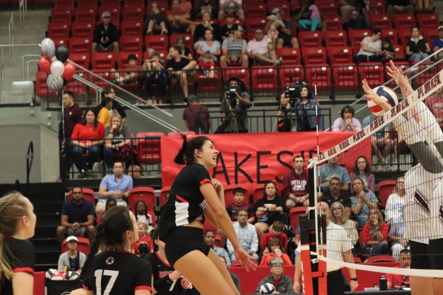 Coppell senior middle hitter Allie Stricker spikes against Plano at Coppell High School Arena on Friday. The Cowgirls defeated Plano 25-9, 25-22, 25-12.