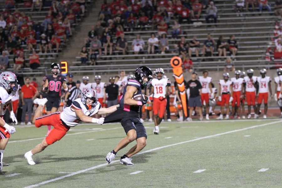 Coppell+junior+wide+receiver+Luca+Grosoli+is+tackled+by+Flower+Mound+Marcus+senior+defensive+back+Jake+Ballard+at+Buddy+Echols+Field+on+Oct.+7.+Coppell+junior+wide+receiver+Luca+Grosoli+is+tackled+by+Flower+Mound+Marcus+senior+defensive+back+Jake+Ballard+at+Buddy+Echols+Field+on+Oct.+7.+Coppell+hosts+Hebron+tomorrow+night+at+Buddy+Echols+Field%2C+kickoff+at+7+p.m.