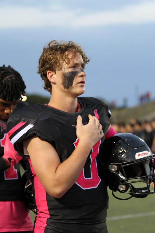 Coppell sophomore tight end Brodie Scoggins lines up for the national anthem at Buddy Echols Field on Friday. Coppell defeated Marcus, 38-14, for the first time in four years.