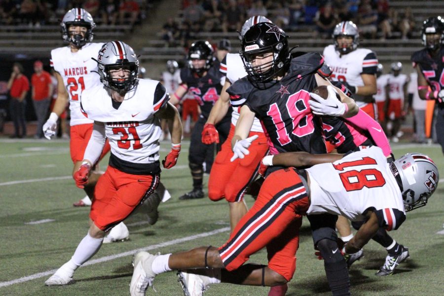 Coppell+senior+wide+receiver+Zack+Darkoch+is+tackled+by+Marcus+senior+defensive+back+Kale+McKnight+at+Buddy+Echols+Field+on+Friday.+Coppell+defeated+Marcus%2C+38-14%2C+for+the+first+time+in+four+years.
