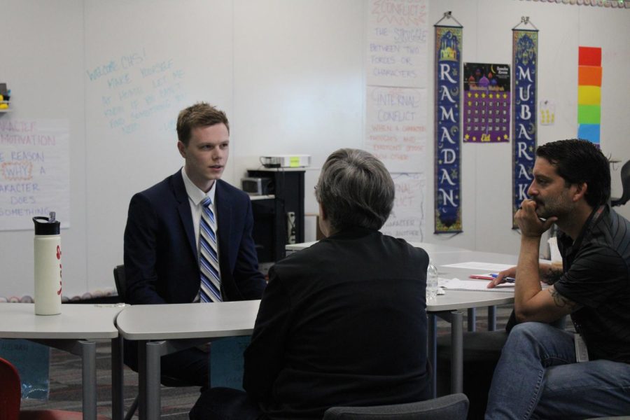 Coppell High School Forensics teacher Joshua Henderson is interviewed at the Coppell ISD job fair on April 10 at CMSW by CHS Principal Laura Springer and former CHS Assistant Principal Chris Gollner. The job fair helped Coppell ISD find teachers for hard to fill subjects. 
