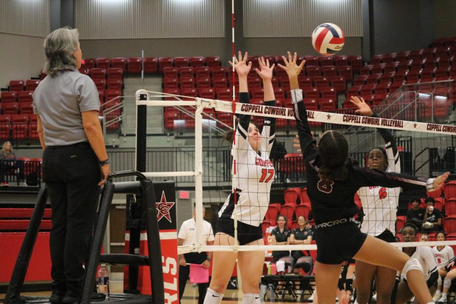 Coppell senior setter Taylor Young and junior middle blocker Ekwe Anwah block against Lewisville in CHS Arena on Friday. The Cowgirls defeated Lewisville, 25-10, 25-8, 25-18.
