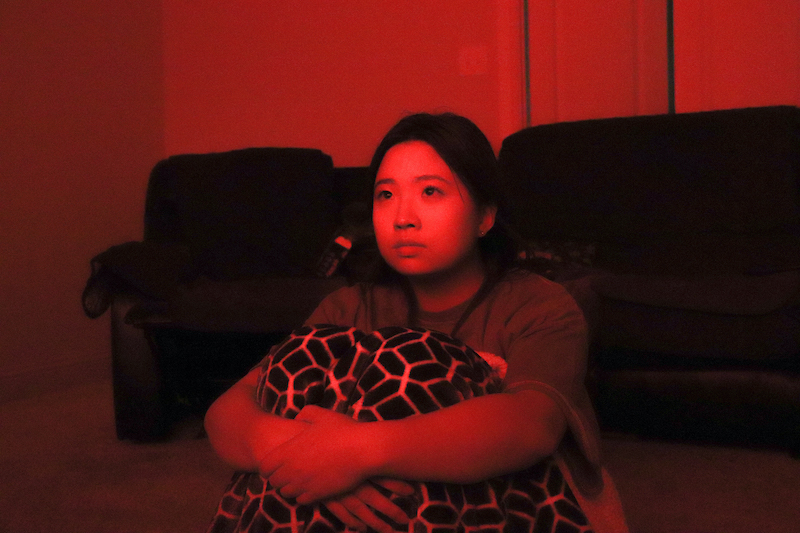 The Sidekick executive editor-in-chief Angelina Liu watches a horror movie, constantly on the edge of her seat in her media room on Oct. 26. Liu writes about how she often partakes in various acts that seem exciting in the moment despite the long-term implications.