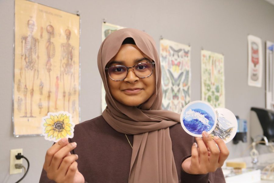 Coppell+High+School+sophomore+Safiya+Mohammed+won+CHS%E2%80%99s+Hurricane+Ian+sticker+design+contest%2C+organized+by+CHS+art+teacher+David+Bearden.+The+contest+was+open+to+all+art+department+students+and+the+top+designs+were+sold+as+stickers%2C+with+all+profits+going+to+World+Central+Kitchen%2C+providing+meals+to+those+affected+by+Hurricane+Ian.+Photo+by+Aliya+Zakir