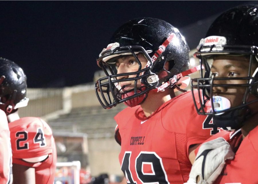 Coppell freshman Black football players Karim Alfarwati and Godson Osuju watch the freshmen game against Hebron on Oct. 20. Alfarwati has played football since eighth grade and plays on a tight and defensive end.