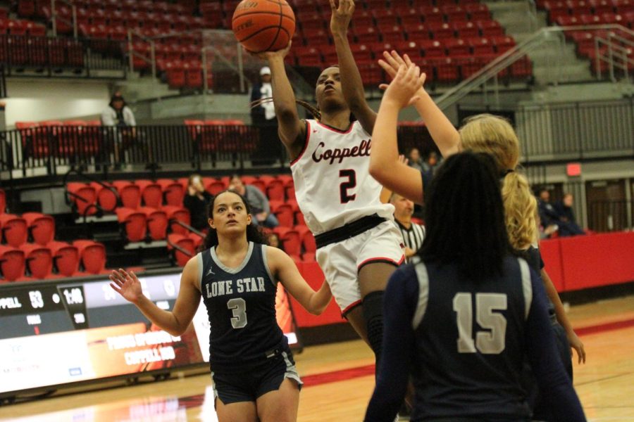 Coppell sophomore guard Londyn Harper shoots a layup against Frisco Lone Star at CHS Arena on Tuesday. Coppell defeated Frisco Lone Star, 75-36.