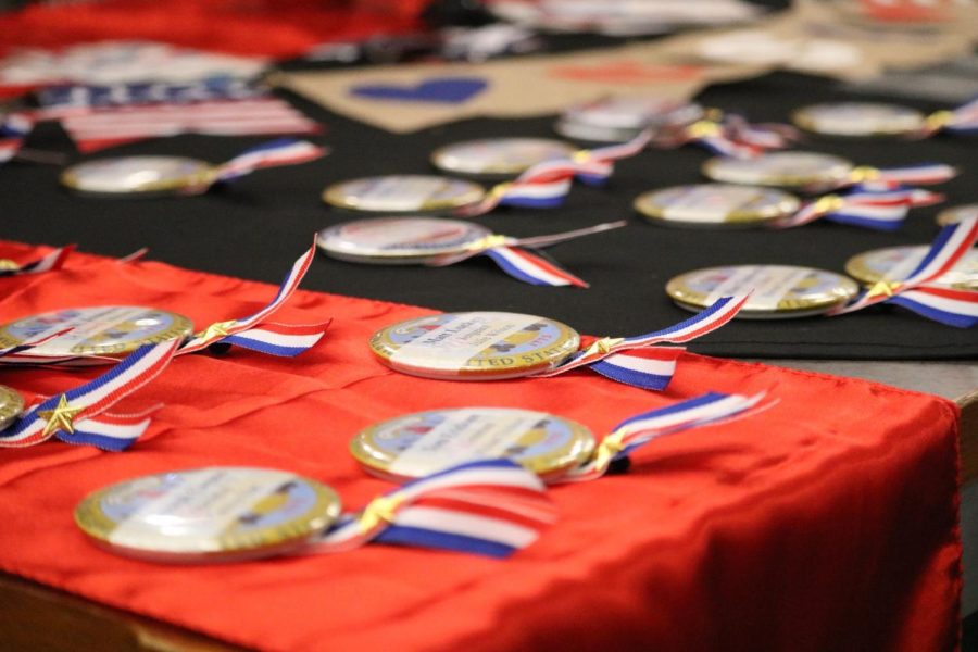 Pins are laid out on the table of the Coppell High School Library for the veterans attending the Veterans Day celebration on Nov. 11. CHS held a Veterans Day breakfast to honor veterans in the Coppell community.
