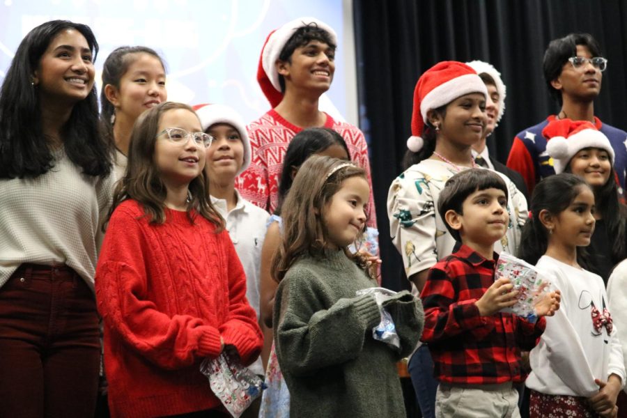 Notelove DFW chapter performers bow at the end of the organization’s holiday sing-along on Wednesday in the Coppell High School Black Box. The DFW chapter of Notelove is a 501(c) certified non-profit aiming to provide free music education to youth in North Texas. 