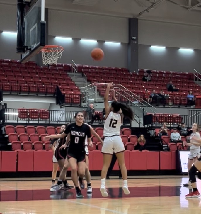 Coppell senior Saiya Patel makes a jump shot against Flower Mound Marcus. The Cowgirls defeated the Marauders, 57-27, on Saturday at CHS Arena.