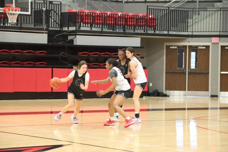 Coppell senior point guard Macey Mercer drives to the basket during practice on Dec. 5. Due to UIL transfer regulations, Mercer was ruled ineligible to participate during the Coppell basketball teams 2021–2022 season after transferring to CHS and has made a return to the court with varsity for her senior season. Photo by Sameeha Syed.