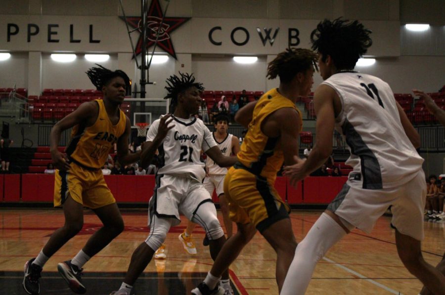 Sophomore+guard+James+Faison+in+the+middle+of+it+during+a+back+and+forth+3rd+quarter.+Coppell+lost+79-68+to+Plano+East+at+the+CHS+Arena+this+Tuesday.