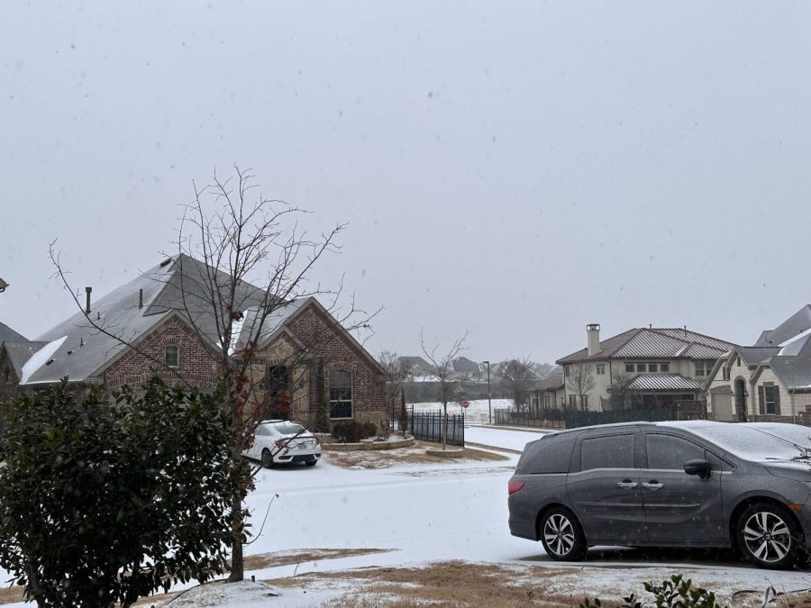 Freezing rain and sleet fall and cover the streets of the Parkside Community in Irving on Tuesday. All administration buildings and schools in Coppell ISD are closed on Tuesday due to inclement weather and possible unsafe road conditions.