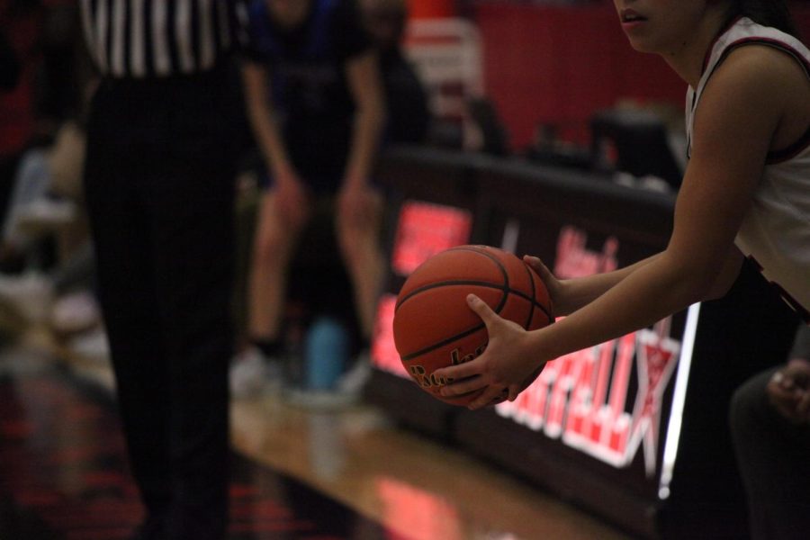 Coppell junior guard Atia Mendenica looks for a free teammate to pass the ball in CHS Arena on Jan. 6. The Cowgirls face the Plano Wildcats tonight at Home. Photo by Shreya Ravi.