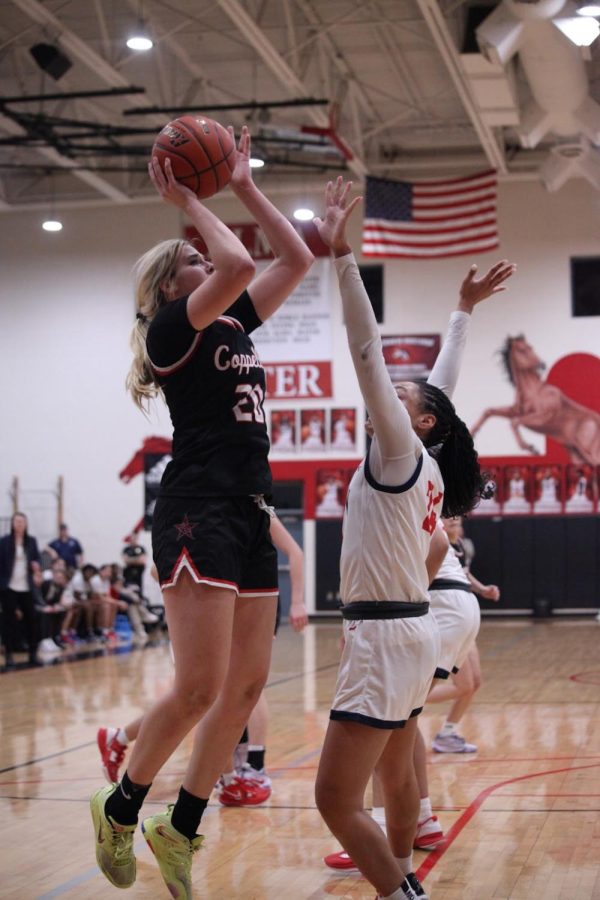 Coppell senior guard Jules LaMendola shoots a jump shot against Allen at Creekview High School on Monday. Coppell defeated Allen in overtime, 41-38. Photo by Olivia Short.