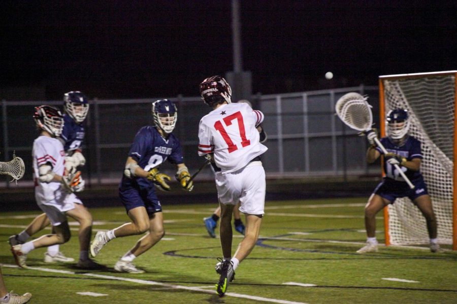 Coppell senior midfield Sean Simpson shoots against Flower Mound at Lesley Field on Monday. The Coppell boys lacrosse team defeated Flower Mound, 10-5. 