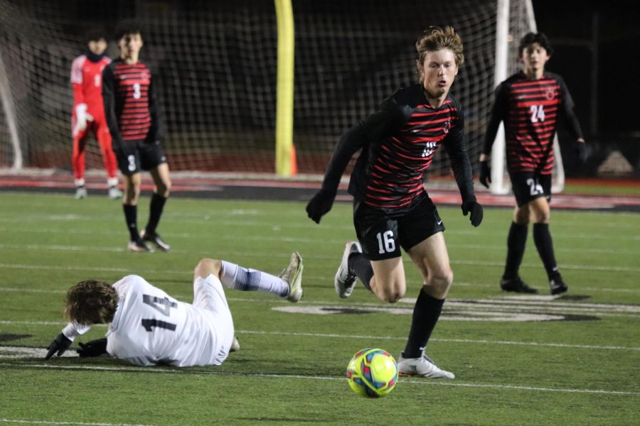 Coppell junior forward Brodie Scott clears against Flower Mound at Buddy Echols Field on Friday. Coppell tied Flower Mound, 0-0.