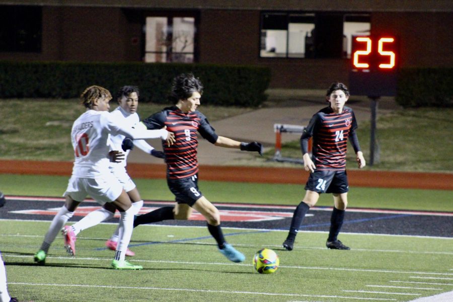 Coppell senior defender Preston Taylor sets up a precise pass at Buddy Echols Field. Coppell lost to Marcus, 1-0, on Friday. 