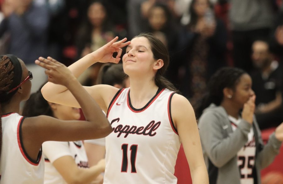 Coppell senior guard Waverly Hassman and Coppell sophomore guard Londyn Harper greet each other during player introductions. The Cowgirls played Plano on Tuesday night at CHS Arena, defeating the Wildcats 85-66. Photo by Nashad Mohamed. 