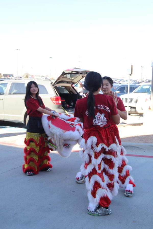 CHS9 student Taylor Pham and Coppell High School senior Isabelle Beach rehearse their lion dance routine. The Pháp Quang lion dance group performed traditional lion dancing as a part of Lunar New Year celebrations at Asia Times Square on Jan. 22.