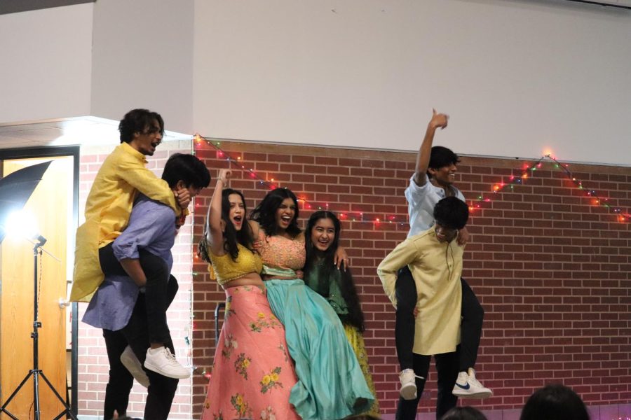 Coppell High School seniors strike their ending pose after their performance in the CHS Commons on Feb. 16. The Junior World Affair Council (JWAC) hosted its  annual Heritage Night to celebrate the diversity at CHS.