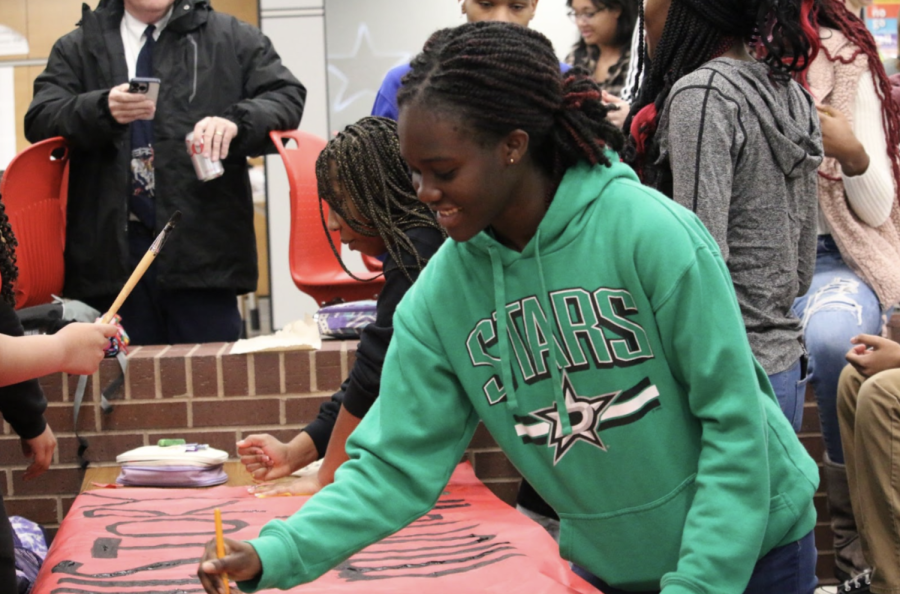 Coppell High School sophomore Sweetie Ansah and other members of the Black Student Union paint a poster commemorating Black History Month. Coppell High School juniors Brandalyn Veail, Sedem Butasi and sophomore Sweetie Ansah founded the Black Student Union Club last May in an effort to instill unity among African American students at Coppell High School. 