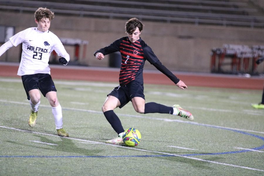 Coppell senior midfielder Ryder Brock passes at Buddy Echols Field on Feb. 17. Coppell tied Plano West, 1-1.