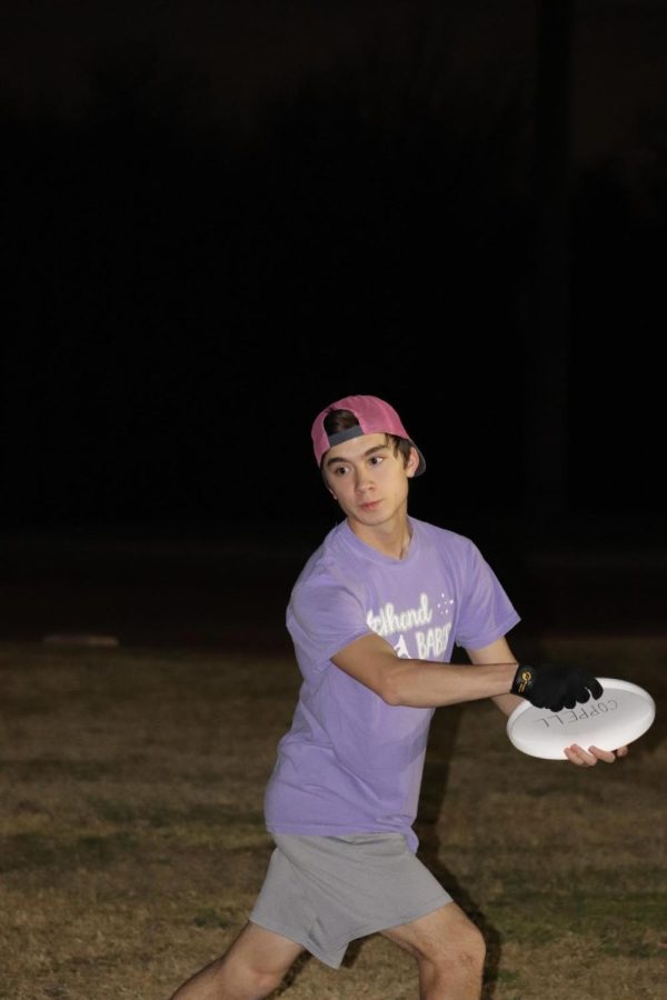 Coppell Ultimate Frisbee team senior head captain Ethan Horng aims during practice at Wagon Wheel Park on Monday. The Coppell Ultimate Frisbee team was founded as a school sponsored club in 2022 and competes in the DFW area as well as state and college tournaments.