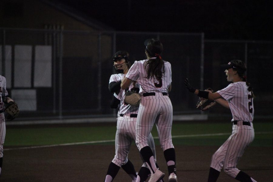 The Coppell softball team celebrates a victorious win against Plano at the Coppell ISD Baseball/Softball Complex on Tuesday. The Cowgirls defeated the Wildcats, 4-0.