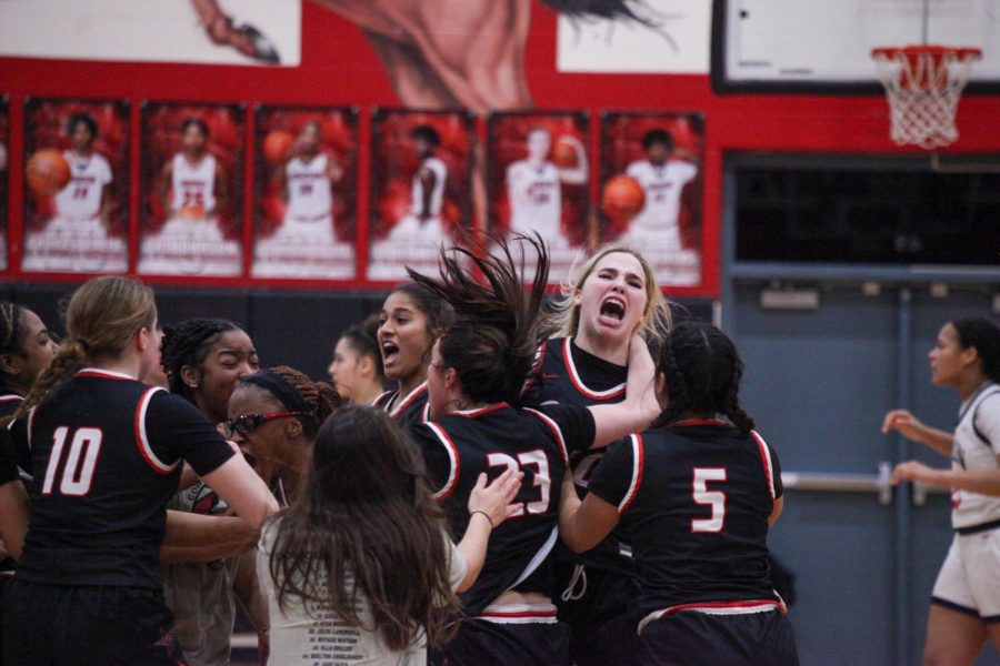 Coppell girls basketball celebrates its win against Allen at Creekview High School on Monday. Coppell defeated Allen in overtime, 41-38.