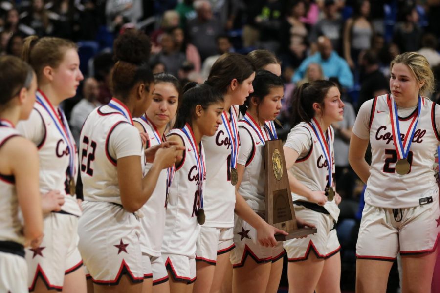 The+Coppell+girls+basketball+team+receives+a+trophy+and+medals+for+being+Class+6A+semifinalists+at+Alamodome+at+San+Antonio+on+Friday.+Coppell+narrowly+fell+to+Northside+Clark%2C+49-48%2C+in+the+Class+6A+semifinals+on+a+last+second+3-pointer+by+Clark%E2%80%99s+Natalie+Huff.