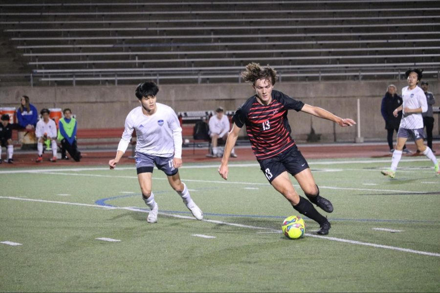Coppell+sophomore+forward+J+McGill+dribbles+against+Hebron+junior+defender+Michael+Vonstein.+Hebron+defeated+Coppell%2C+2-0%2C+on+Friday+at+Buddy+Echols+Field.+