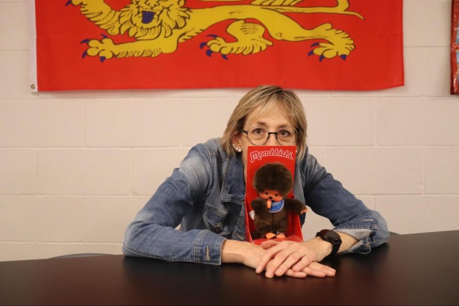 CHS9 French I and Spanish I teacher Fabienne Morel poses with her Monchhichi toy, a stuffed monkey beloved in all her classes for its regular appearance in lesson plans. Morel has been teaching at CHS9 since 2019 and is loved by her students for her engaging personality.