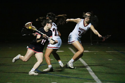 Coppell junior defender Berlynn Engelhardt blocks Lovejoy offense at Coppell Middle School North field on Feb. 28. Lovejoy defeated Coppell, 18-13. 