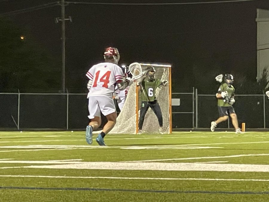 Coppell sophomore attack Edward Griffin looks to score against Southlake Carroll senior goalie Zane Mammoser. The Coppell boys lacrosse team fell to Southlake on Friday night, 9-7. 