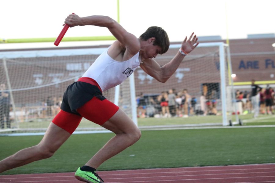 Coppell%E2%80%99s+200-meter+%26+400-meter+relay+runner%2C+junior+Baron+Tipton%2C+takes+off+in+the+relay+race+at+the+District+6-6A+meet.+Coppell+qualified+23+athletes+to+Area+while+also+becoming+back+to+back+boys+District+6-6A+champions.+Photo+by+Josh+Campbell.