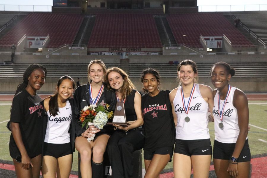 Coppell girls track and field poses with their 3rd place trophy following the District 6-6A/ 5-6A Area Track and Field Meet. Coppell qualified seven girls to regionals and set both a school and personal record.