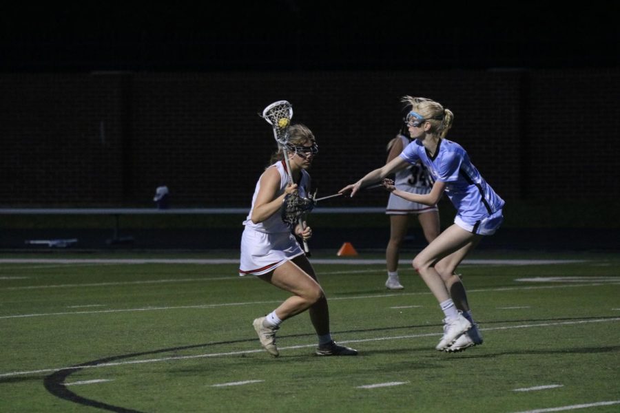 Coppell High School junior midfielder Kate Nelson drives the ball towards the goal. Coppell defeated Plano, 18-3, on April 4. 