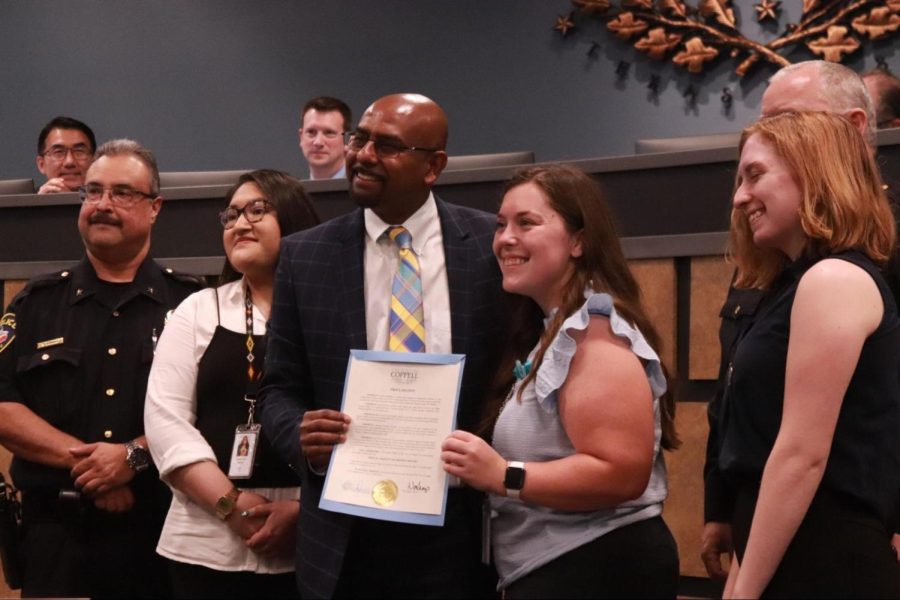 Coppell City Council member Biju Mathew presents the proclamation to make April “Sexual Assault Awareness Month.” Coppell Police Chief Danny Barton presented about fentanyl to raise awareness for the drug.