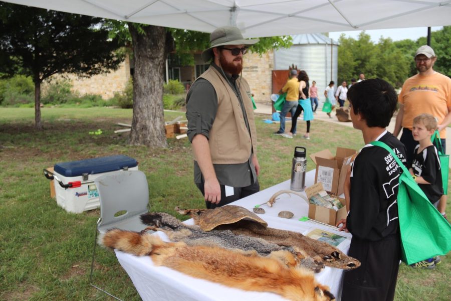 Jonathan Ward with the Biodiversity Education Center at Coppell Nature Park educates visitors about animals found in Coppell such as the red fox, gray fox and bobcat on Saturday. The park hosts Earthfest with booths about environmental education and sustainability.