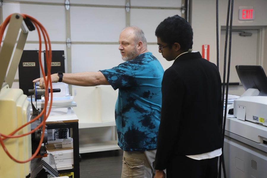 Coppell High School junior Kapill Balaji learns the ropes of entrepreneurship with AlphaGraphics owner Sam Reed. Coppell ISD hosted a job shadowing opportunity open to juniors and seniors that matched students to professionals in their preferred field. Photo courtesy CISD Communications.