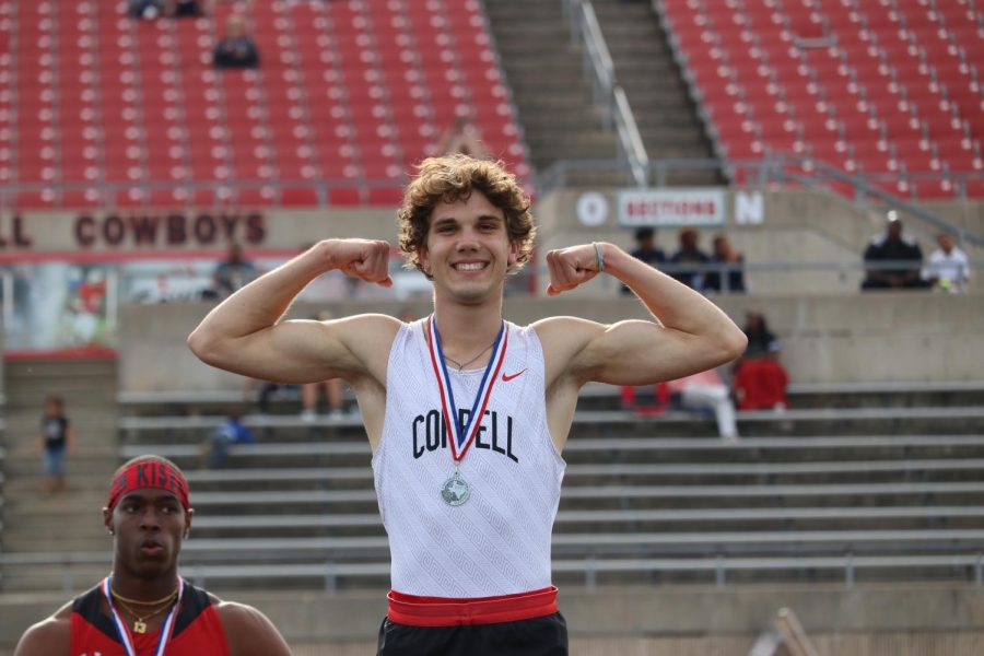 Coppell junior Aidan McFarlane poses on the podium at the District 5/6A Area Track and Field meet on April 21 at Buddy Echols Field. Coppell qualified 23 athletes to area while also becoming back-to-back boys District 6-6A champions. 
