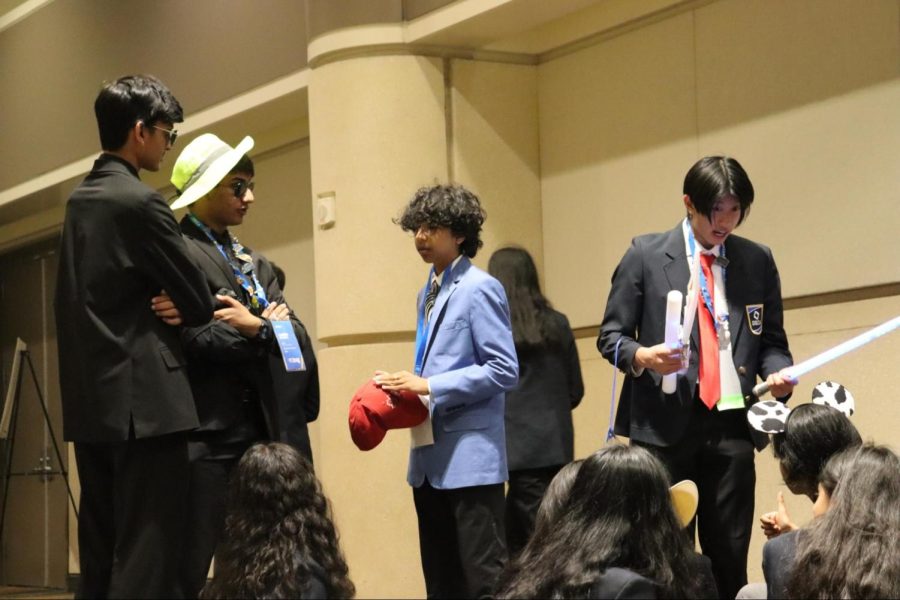 CHS9 student Yuvan Sampath converses with fellow Coppell High School competitors at the DECA International Career Development Conference in Orlando, Fla. on April 22-25. Sampath attributes his success to his extracurricular activities. 